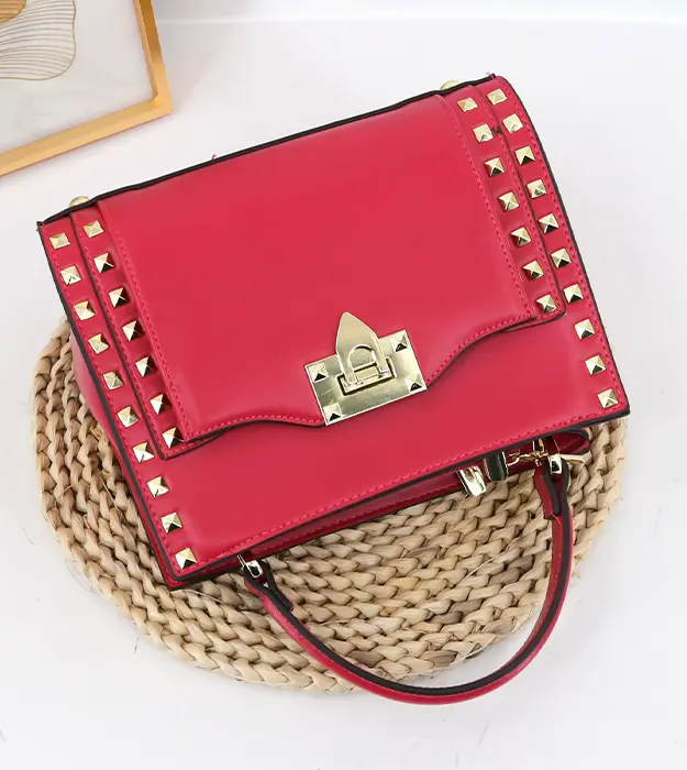 Ženska torba Arelith Frame u ciklama boji sa metalnim okvirom i dekorativnom bravicom